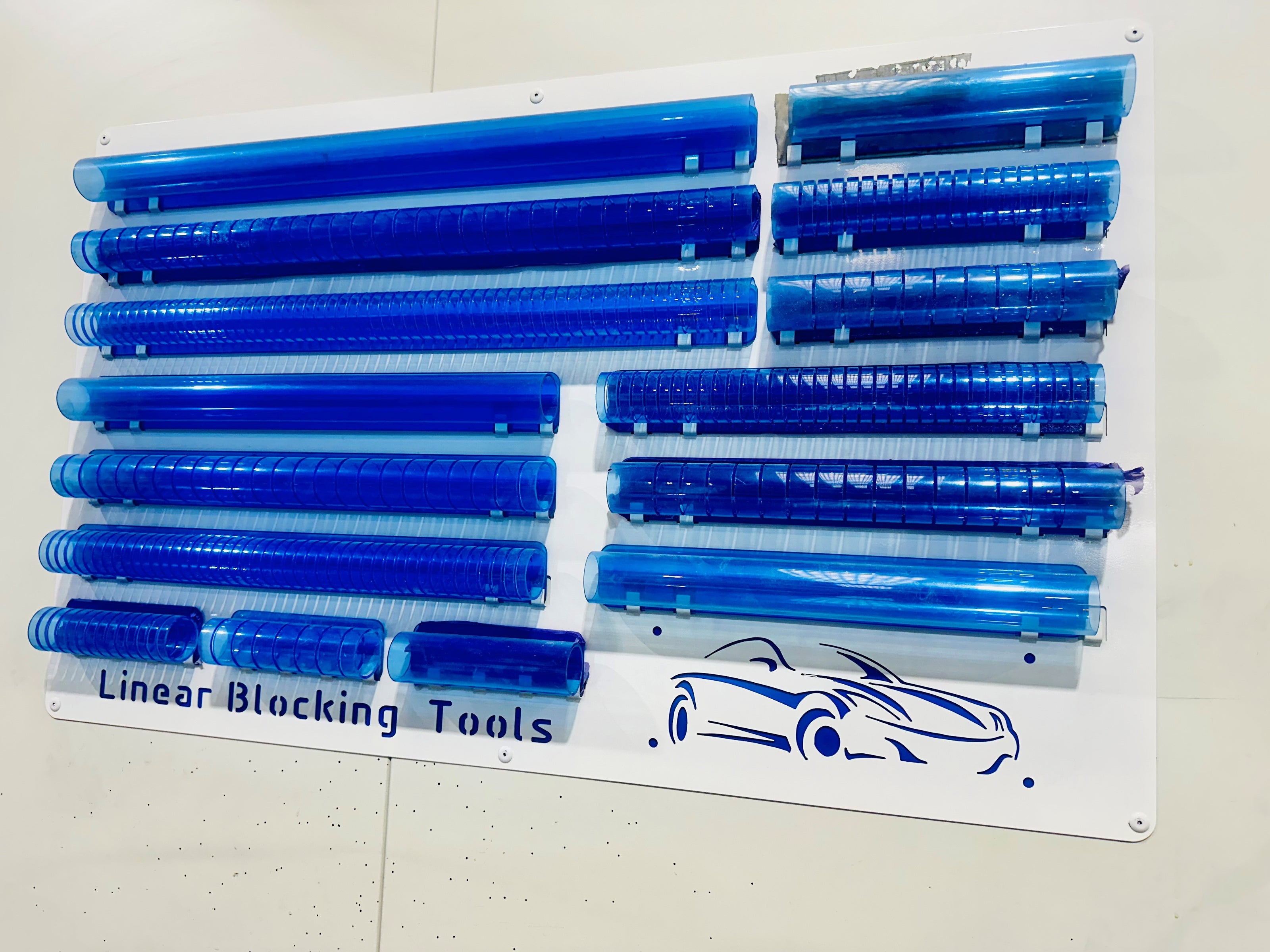 Set of blue linear blocking tools on the linear storage rack.